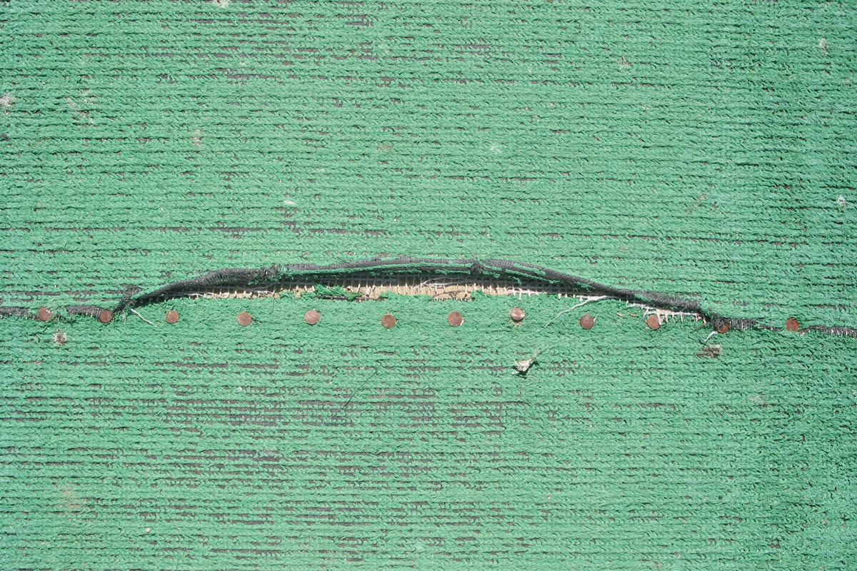 Damaged green carpet