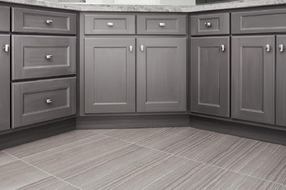 Gray shaker style kitchen with gray cabinet and porcelain floor tiles
