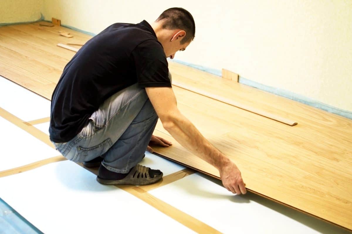 The process of installing laminate wooden on the floor.