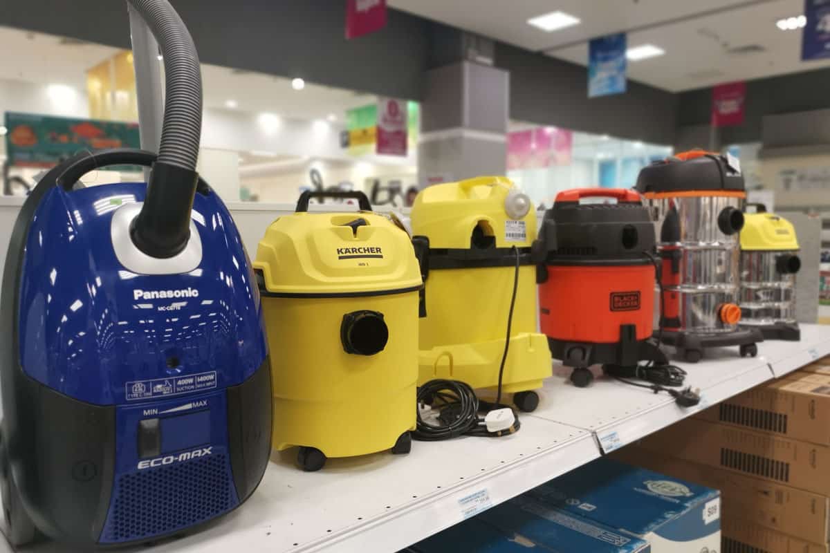 Variety types and brands of home vacuum cleaner equipment on the shelves for display and sale at Aeon Electrical Sri Manjung Shopping