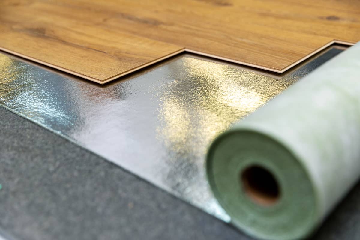 floor laminate installation, shiny foil, wood floor tiles, brown wood