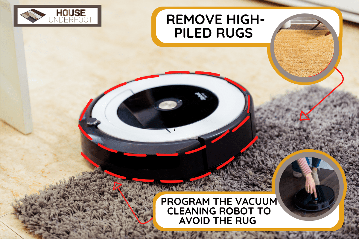 irobot vacuum cleaner roomba cleaning a gray carpet. home cleaning concept.