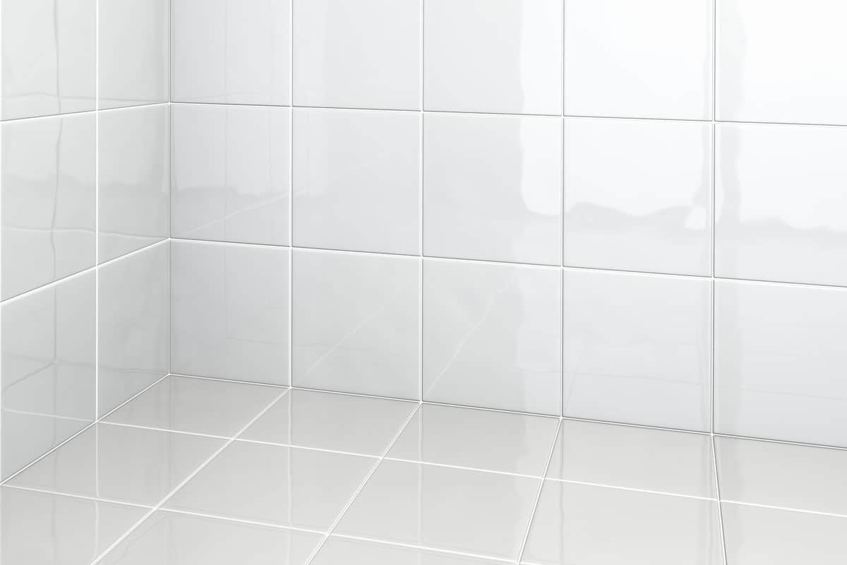 photo of a bathroom corner, white bathroom floor tiles, clean bathroom