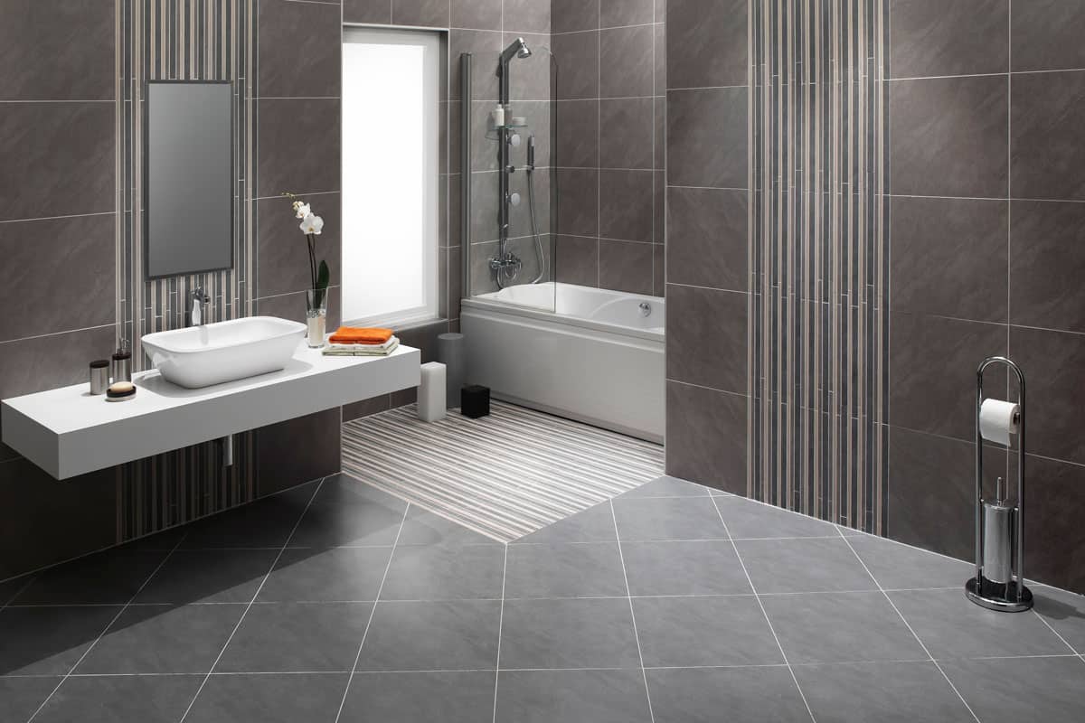 photo of a modern bathroom on the hotel, grey bathroom floor tiles