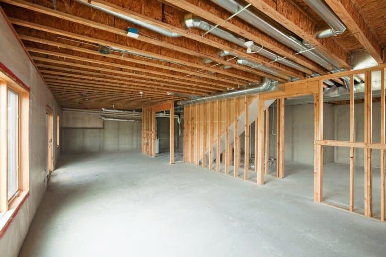 Basements are often left looking like this after initial construction, Can You Run A Toilet Drain Through Floor Joist?