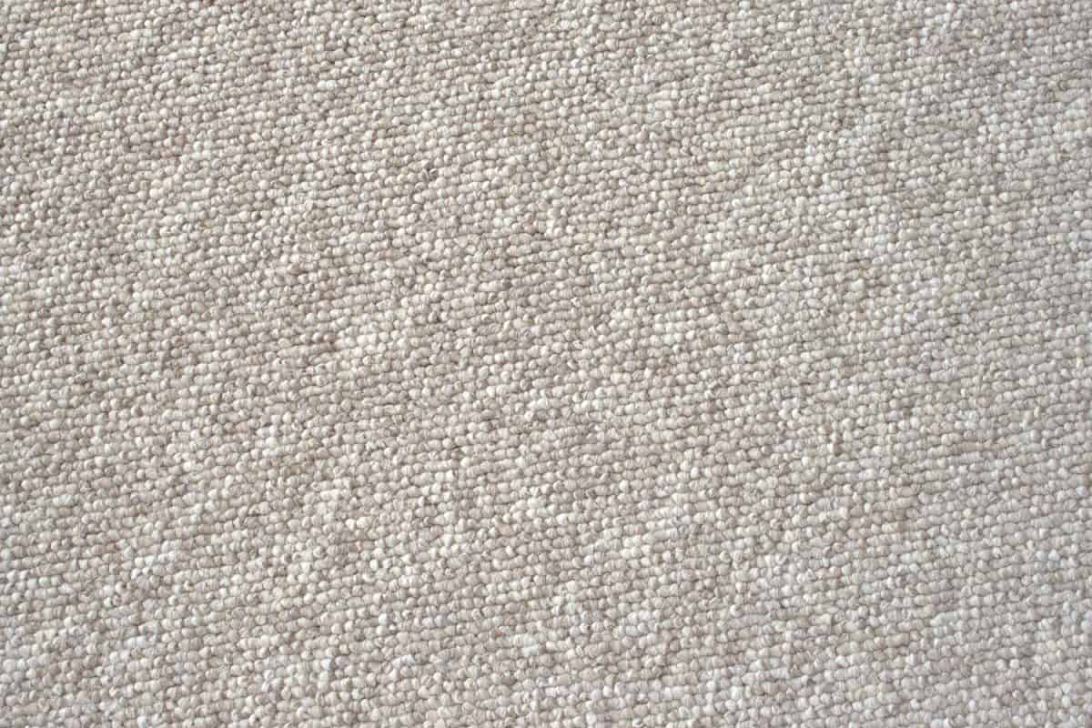 Beige nylon carpet, uncut level loops as used in high-traffic areas
