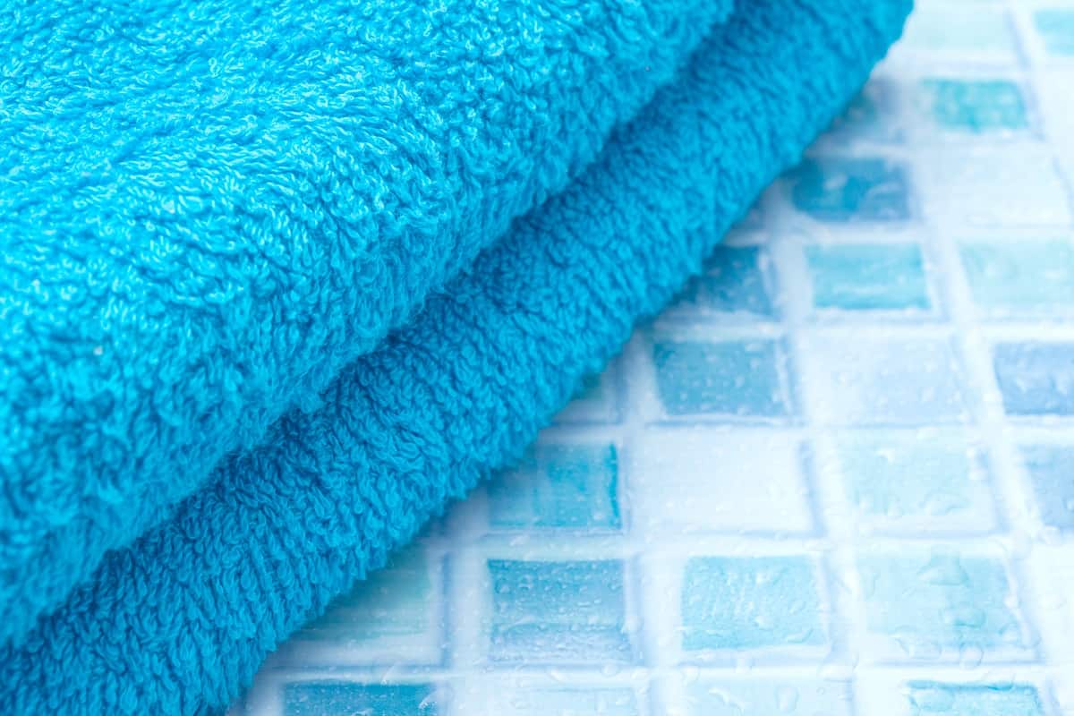 Boho Touch - Blue Bath Towels on Bathroom Tiles