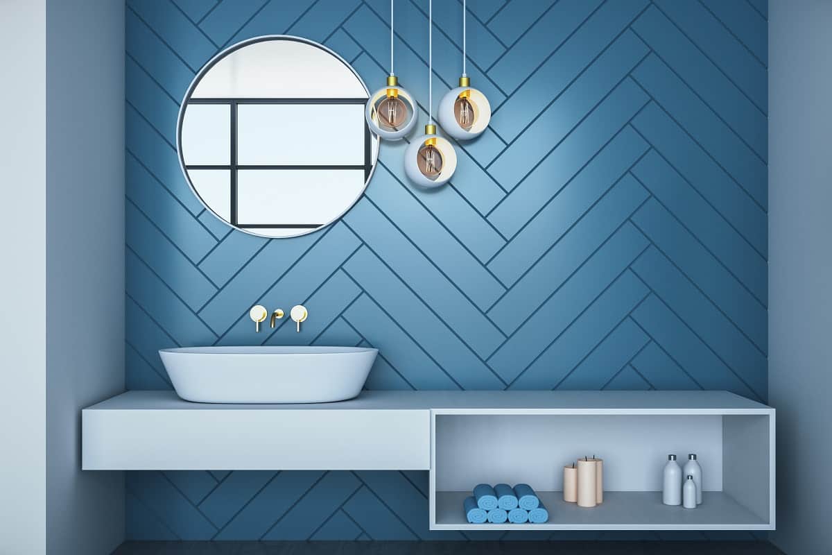 Floor To Wall Style - Cozy blue bathroom interior with bath and decorative objects