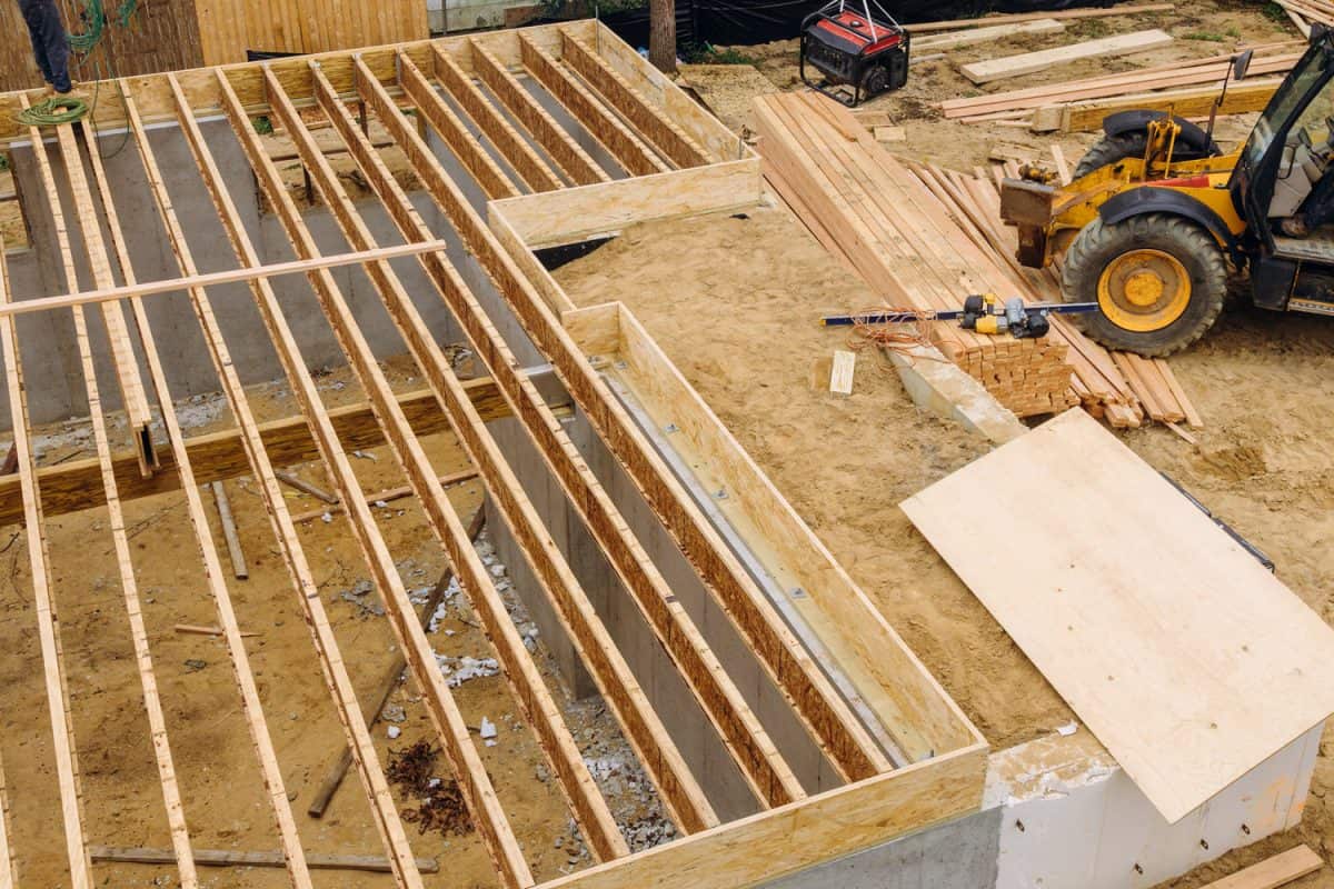 House framing floor construction showing massive solid wood joists trusses

