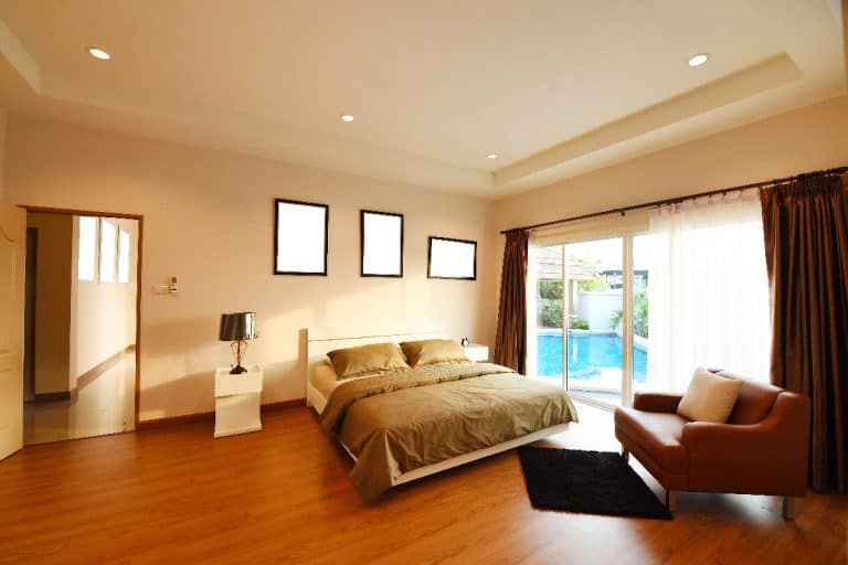 Interior of modern comfortable bedroom, Should Bedroom Floors Match Throughout House?