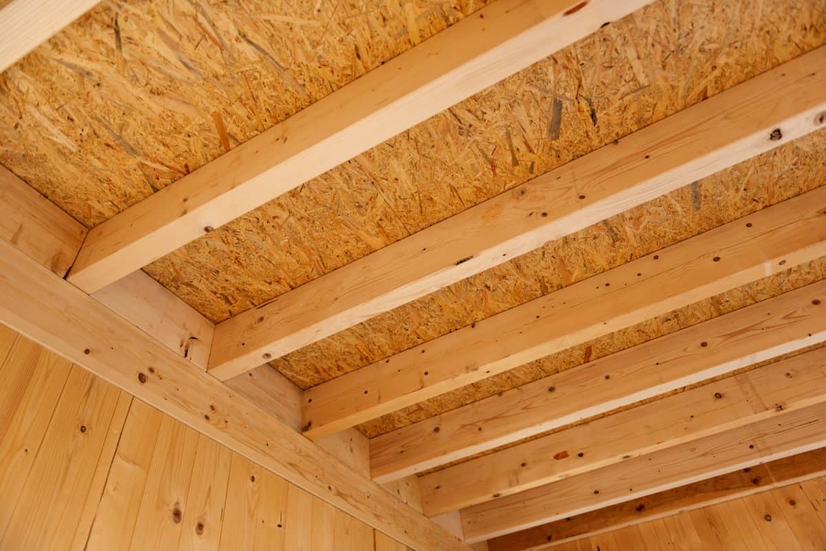 Interior view of a wooden roof structure with beams