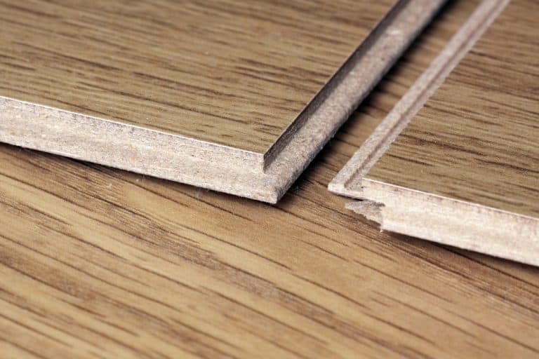 Laminate floor linking, close up , How To Cut Out A Section Of Floorboard [And Best Tools For The Job]