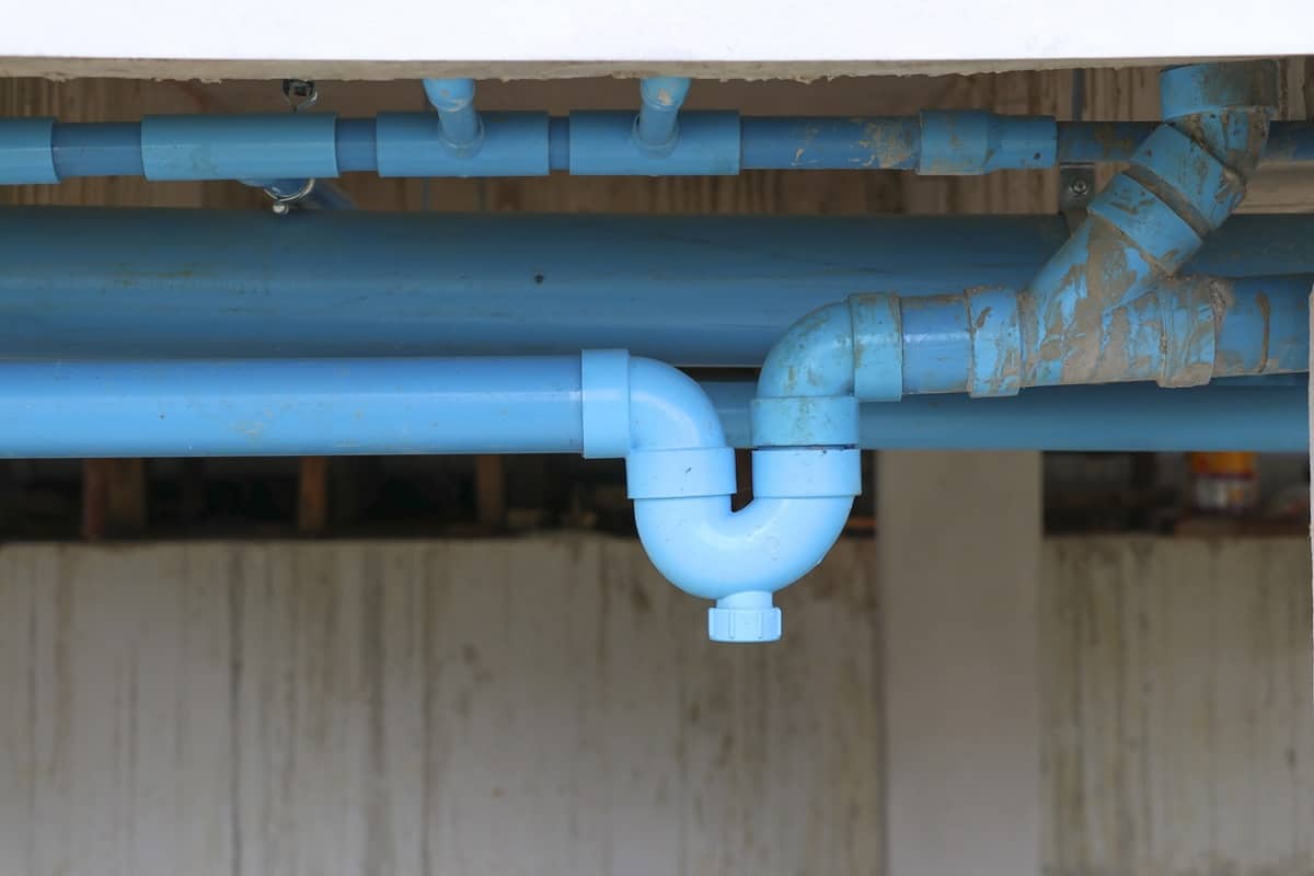 Plumbing System - Blue P-trap pvc for reverse odor protection. Blue sanitary P-trap installed at site construction.