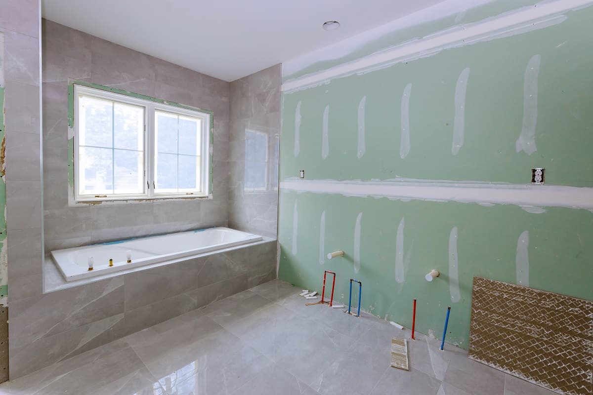 Prepare the Area - Under construction new bathtub remodeling a home bathroom