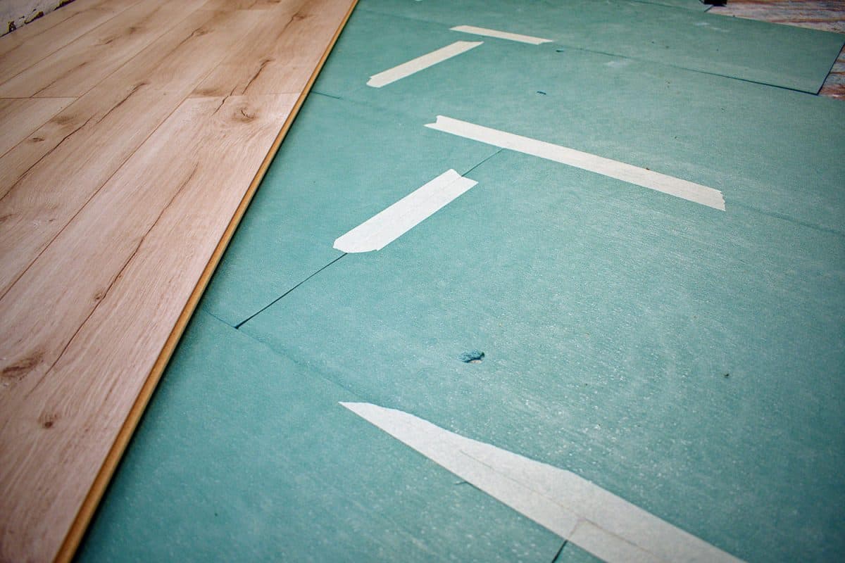 Underlayment for laminate and laminate flooring. Laminate installation concept.

