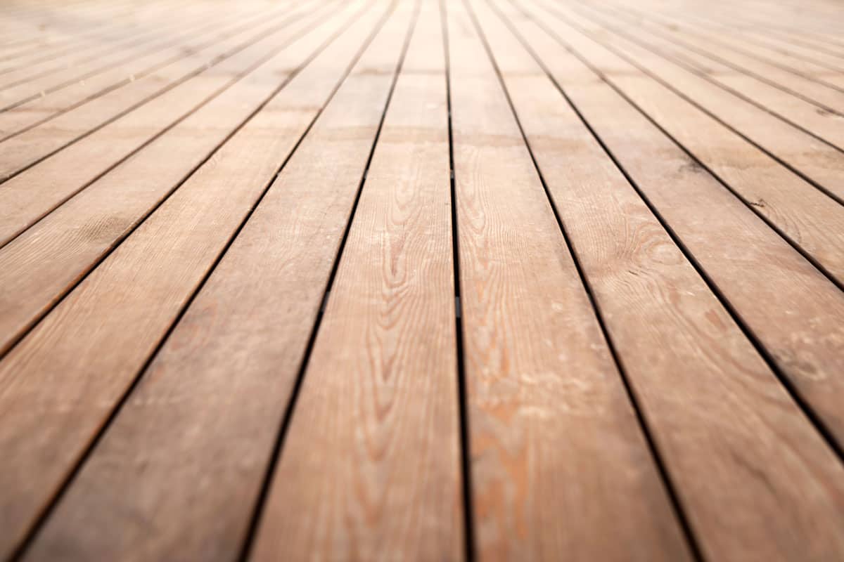 close up photo of a wood floor tile on the outdoor of the house