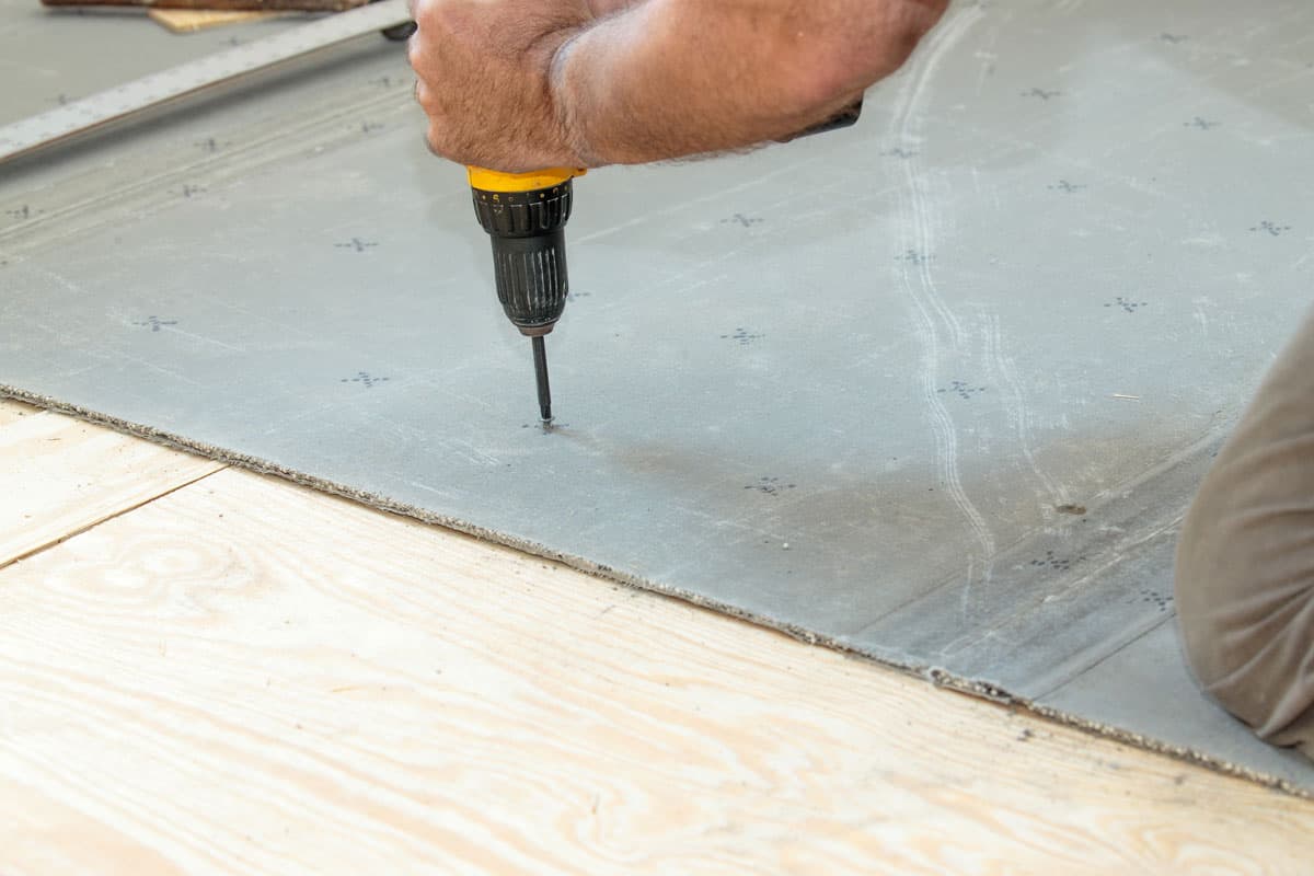 photo of a Screwing cement board to the subfloor