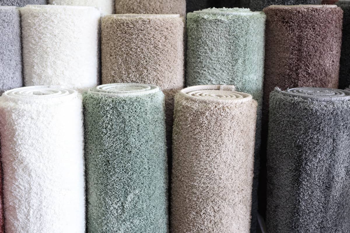 A stockpile of brand-new carpet displayed at a store
