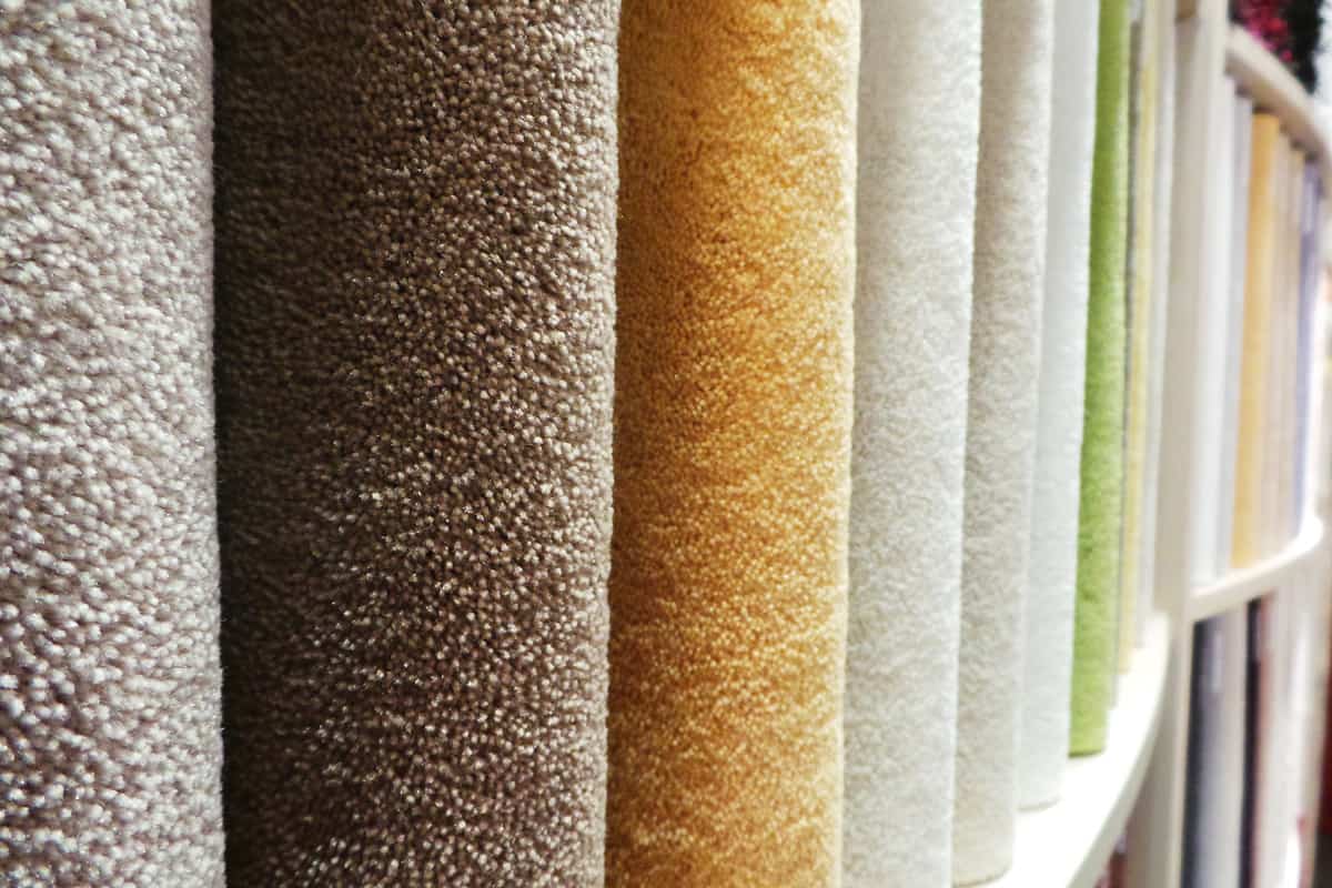 Different colors of carpets displayed at a Home Depot store