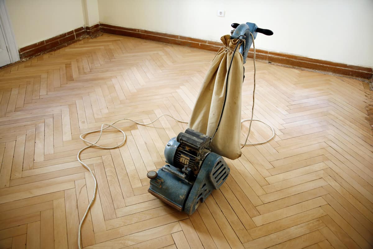 Professional equipment to sand the floors down to the bare wood.