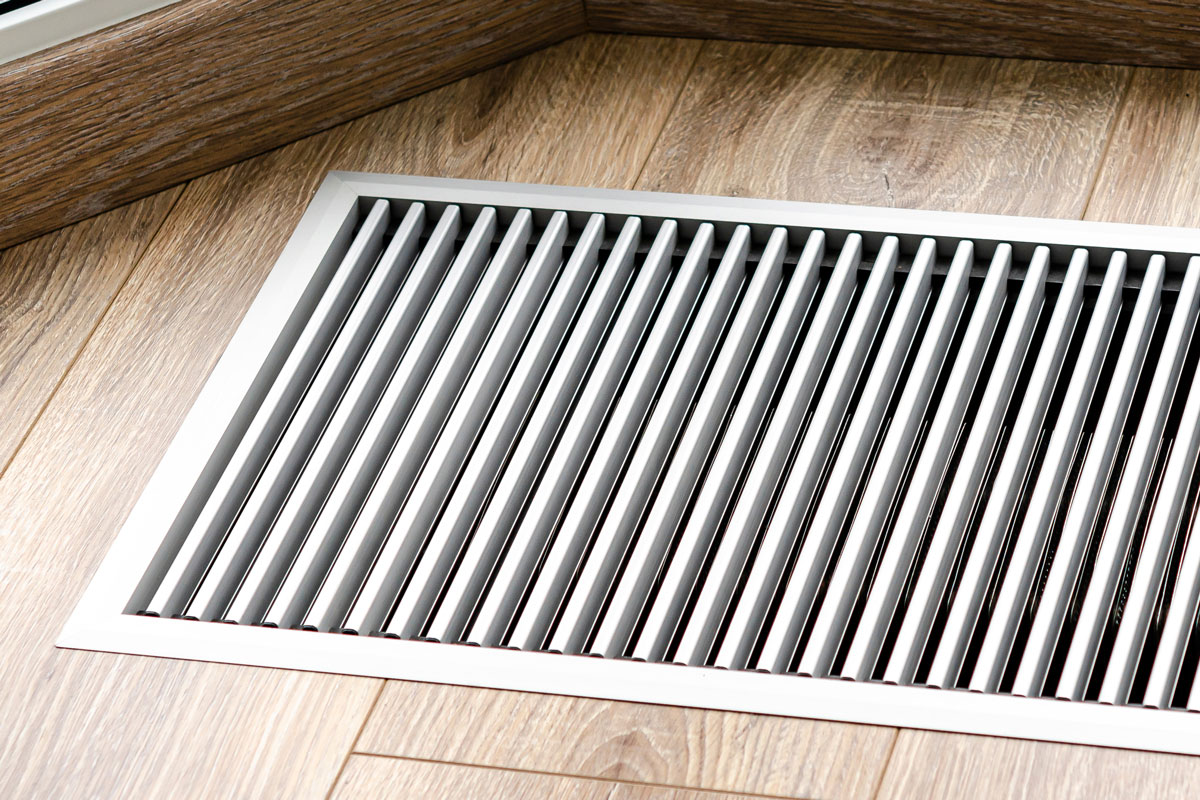 Protective radiator grille built into the floor for heating panoramic windows.